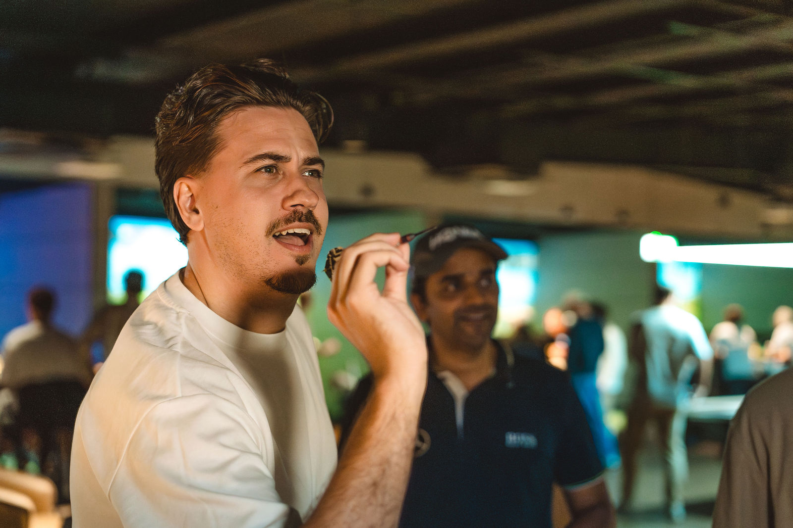 Mates throwing darts at GolfSpace